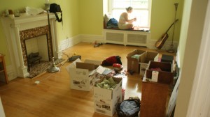 The last seat in the house and the one I'll miss the most - the window seat. Our house is littered with boxes and half-packed luggage. 