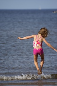 Morgane frolicks on Parlee Beach in New Brunswick.