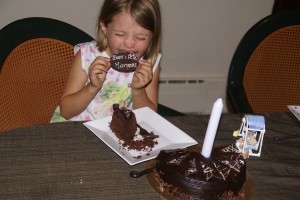 DSC00905 Morgane eats the chocolate off the top of her birthday cake.
