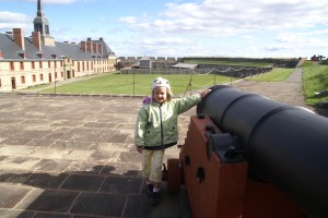 Morgane was impressed by and a bit worried about the cannons. Here, she is proud to pose for a picture with one.