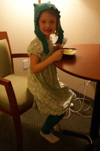 M enjoys microwave mac and cheese while modelling her new felt hat and leg warmers (from the market in Bridgewater).