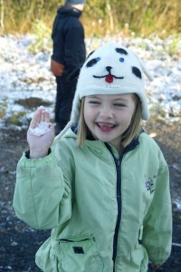 Morgane aims a snowball at my window.