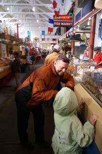 Morgane and Ghis admire live seafood at the market in St. John
