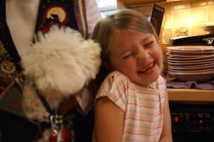 Morgane getting a tickle from Gracie the puppy.