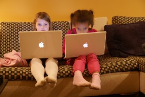Girls on Macs. They are enjoying typing and exploring different fonts. Maybe they'll be email buddies.