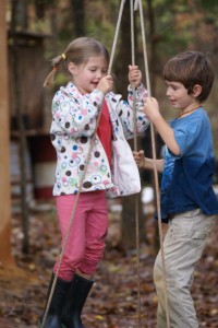 Morgane and Jasper bouncing on the tire swing.