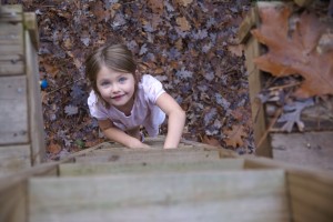 Morgane climbs the tree house.