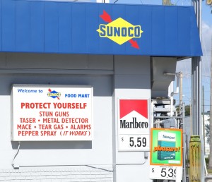 A scary sign at the gas station next to the restaurant.