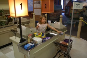 Morgane checking out groceries at the museum.